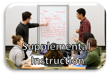 Four people sitting at a table, two people are standing at the whiteboard with Supplemental Instruction written on the photo.
