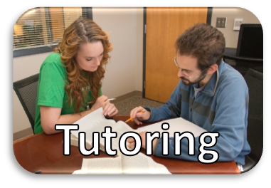 Photo of two people looking at study materials with Tutoring Services written on the photo
