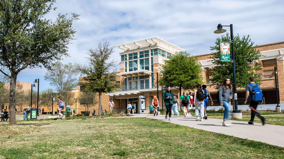 Students walk in front of the UNT Union