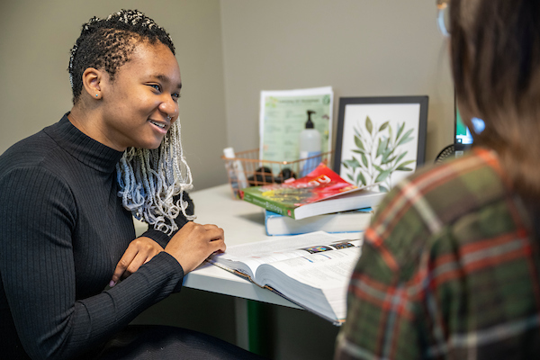 A UNT student receiving tutoring at the Learning Center